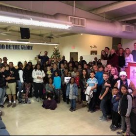 Large group celebrating Christmas together.