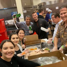 Volunteers preparing food for donation.