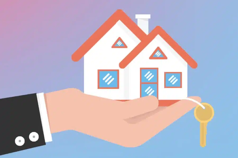 Hand holding house and key