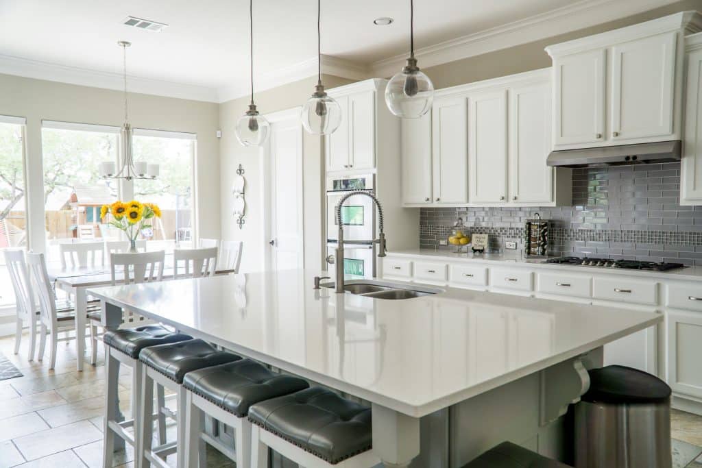 Modern kitchen with white cabinetry and island