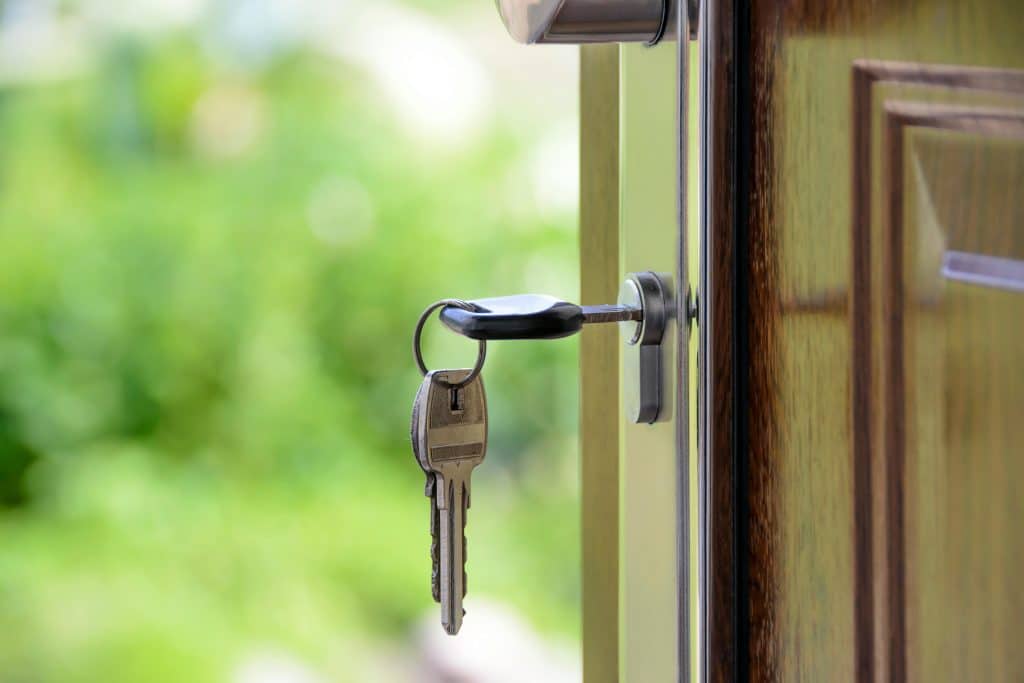 Key in door, inviting entry.
